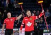 Canada skip Brad Gushue, front right, and third Mark Nichols celebrate after defeating Alberta-Jacobs during the playoffs at the Brier in Kelowna, B.C., on Friday, March 7, 2025. THE CANADIAN PRESS/Darryl Dyck