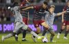 Toronto FC midfielder Jonathan Osorio (21) breaks through  CF Montreal defenders Kwadwo Opoku and Bryce Duke (right) during MLS action in Toronto on Sunday, Aug. 20, 2023. Osorio added to his resume with a goal in Toronto FC's season-opening draw at D.C. United, marking the 13th straight season in which he has scored. The Toronto captain is now one goal away from joining Major League Soccer's exclusive 50-goal, 50-assist club. THE CANADIAN PRESS/Frank Gunn