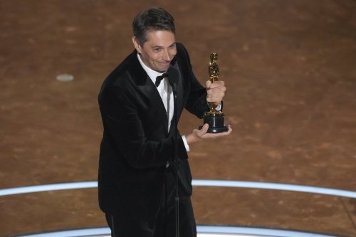 Sean Baker accepts the award for best original screenplay for 
