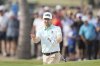 Brian Campbell, of the United States, reacts after his shot from a bunker on the 18th hole during the final round of the Mexico Open golf tournament in Puerto Vallarta, Mexico, Sunday, Feb. 23, 2025. (AP Photo/Fernando Llano)