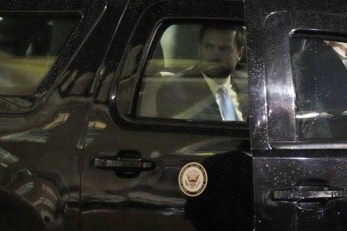 United States Vice-President JD Vance looks out of the car window as he arrives for a dinner at the Elysee Palace, during an event on the sidelines of the Artificial Intelligence Action Summit in Paris, Monday, Feb. 10, 2025. (AP Photo/Aurelien Morissard)