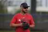 Washington Nationals infielder Paul DeJong takes part in a drill during a spring training baseball practice Tuesday, Feb. 18, 2025, in West Palm Beach, Fla. (AP Photo/Jeff Roberson)