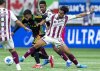 Vancouver Whitecaps' Pedro Vite (left) and Deportivo Saprissa's Ariel Rodriguez (right) vie for the ball during the first half of a CONCACAF Champions Cup soccer match in Vancouver, on Thursday, February 27, 2025. THE CANADIAN PRESS/Ethan Cairns