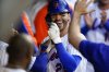 FILE - New York Mets' Tyler Naquin celebrates with teammates after hitting a home run during the second inning of the team's baseball game against the Atlanta Braves on Aug. 4, 2022, in New York. (AP Photo/Frank Franklin II)