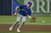 FILE - Toronto Blue Jays first baseman Spencer Horwitz reaches for an infield grounder during a baseball game against the Tampa Bay Rays Saturday, Sept. 21, 2024, in St. Petersburg, Fla. (AP Photo/Steve Nesius, File)