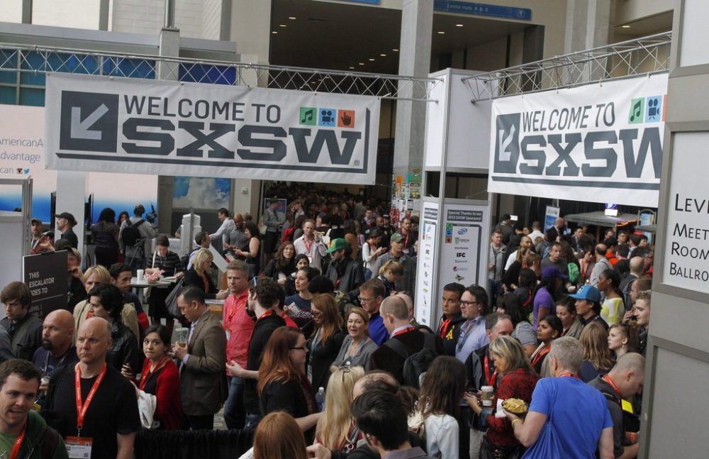 In this March 9, 2013, file photo, SXSW Interactive and Film Festival attendees crowd the Austin Convention Center in Austin, Texas. Canadian filmmakers affected by this week's South By Southwest festival cancellation say the industry is hurting from the fallout of the novel coronavirus but they're hopeful stakeholders will find a new way to screen movies, perhaps virtually. THE CANADIAN PRESS/AP Photo/Jack Plunkett, File