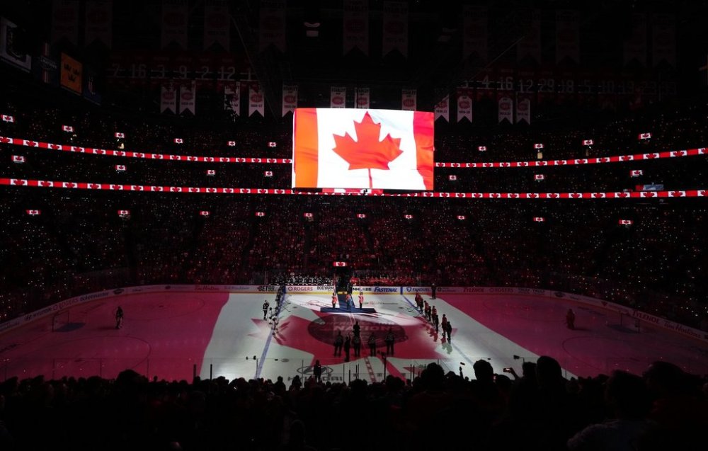 Players and fans stand for the Canadian national anthem prior to first period 4 Nations Face-Off hockey action between Canada and the United States in Montreal on Saturday, Feb. 15, 2025. THE CANADIAN PRESS/Christinne Muschi