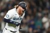 FILE - Seattle Mariners' Justin Turner reacts to hitting a solo home run against the New York Yankees during the eighth inning of a baseball game Wednesday, Sept. 18, 2024, in Seattle. (AP Photo/Lindsey Wasson, File)