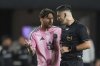 Inter Miami forward Lionel Messi, left, talks with the referee during the first half of an MLS soccer match against New York City FC, Saturday, Feb. 22, 2025, in Fort Lauderdale, Fla. (AP Photo/Rebecca Blackwell)