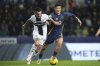 Roma's Eldor Shomurodov fights for the ball with Parma's Emanuele Valeri, left, during the Italian Serie A soccer match between Parma and Roma, at the Ennio Tardini Stadium in Parma, Italy, Sunday Feb. 16, 2025. (Massimo Paolone/LaPresse via AP)