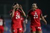 Canada's Marie Yasmine Alidou, left, celebrates after scoring during the international women's friendly soccer match between Canada and South Korea at the Pinatar Arena Football Center in Murcia, Spain, on Tuesday, Dec. 3, 2024. THE CANADIAN PRESS/AP/Francisco Macia Martinez