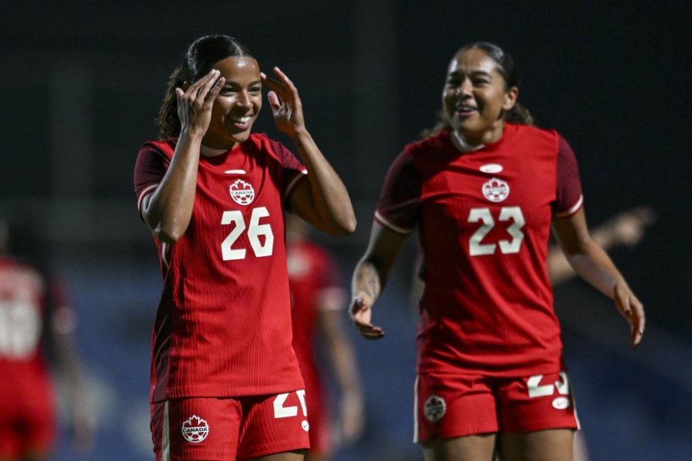 Canada's Marie Yasmine Alidou, left, celebrates after scoring during the international women's friendly soccer match between Canada and South Korea at the Pinatar Arena Football Center in Murcia, Spain, on Tuesday, Dec. 3, 2024. THE CANADIAN PRESS/AP/Francisco Macia Martinez
