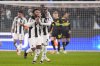 Juventus' Weston McKennie, foreground, celebrates after scoring their side's first goal of the game during the Champions League playoff first leg soccer match between Juventus and PSV Eindhoven at the Juventus stadium in Turin, Italy, Tuesday Feb. 11, 2025. (Fabio Ferrari/LaPresse via AP)