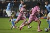 Inter Miami forward Lionel Messi, center, passes to midfielder Telasco Segovia to score the side's second goal against New York City FC, tying the game in the final minutes of stoppage time in their MLS soccer match, Saturday, Feb. 22, 2025, in Fort Lauderdale, Fla. (AP Photo/Rebecca Blackwell)