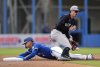 Toronto Blue Jays second baseman Andrés Giménez (0) steals second base past New York Yankees second baseman Braden Shewmake (89) during first inning Grapefruit League MLB baseball action in Dunedin Fla., on Saturday, February 22, 2025. THE CANADIAN PRESS/Nathan Denette