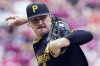 FILE - Pittsburgh Pirates' Paul Skenes throws during the first inning of a baseball game Cincinnati Reds, Sunday, Sept. 22, 2024, in Cincinnati. (AP Photo/Kareem Elgazzar, File)