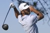Max Homa hits his tee shot on the 11th hole of the North Course at Torrey Pines during the second round of the Farmers Insurance Open golf tournament Thursday, Jan. 23, 2025, in San Diego. (AP Photo/Denis Poroy)