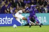 Toronto FC defender Henry Wingo, left, and Orlando City forward Iván Angulo, right, fight for the ball during the second half of an MLS soccer match, Saturday, March 1, 2025, in Orlando, Fla. THE CANADIAN PRESS/AP-Kevin Kolczynski