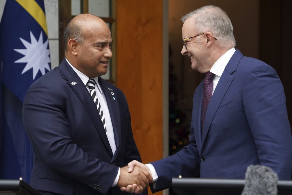 Nauru President David Adeang, left, and Australian Prime Minister Anthony Albanese shake hands at Parliament House in Canberra, Dec. 9, 2024. (Dominic GianniniAAP Image via AP)
