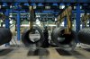 FILE - A worker transfers steel cables at a steel factory in Qingdao in east China's Shandong province, on June 8, 2018. (Chinatopix via AP, File)