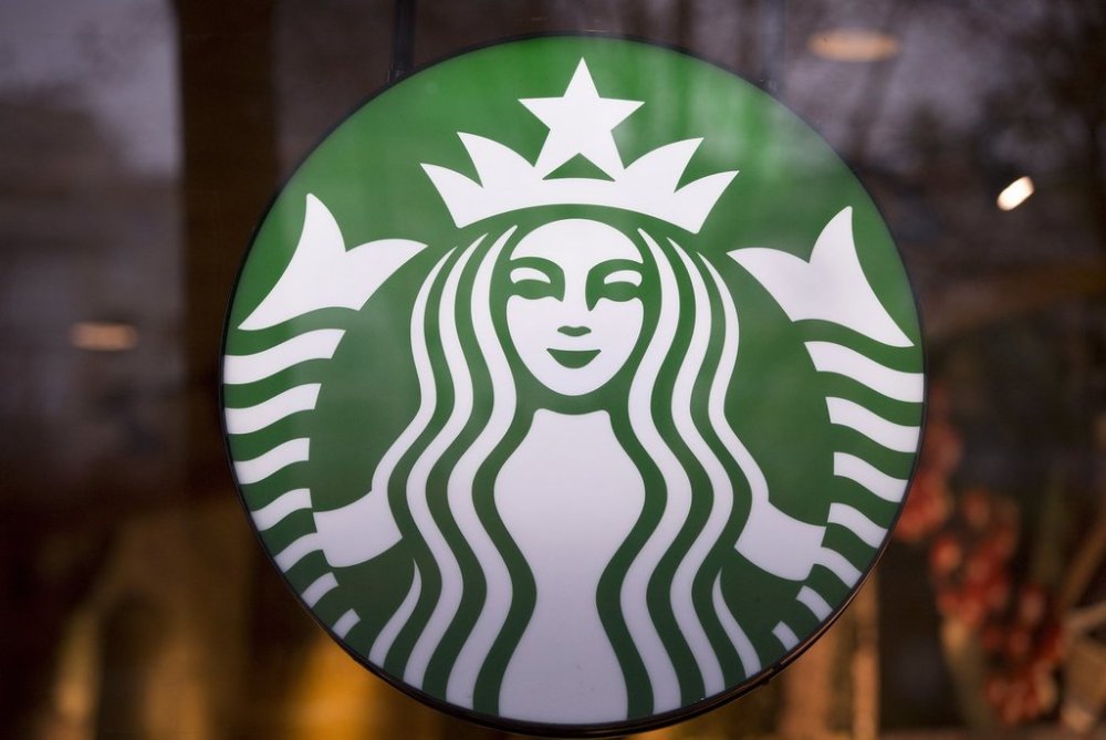 A Starbucks sign is pictured in downtown Vancouver, B.C., March 20, 2015. THE CANADIAN PRESS/Jonathan Hayward