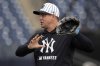 New York Yankees manager Aaron Boone demonstrates a play during a spring training baseball workout Thursday, Feb. 20, 2025, in Tampa, Fla. (AP Photo/Chris O'Meara)
