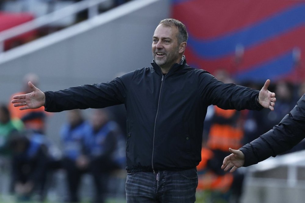 Barcelona's head coach Hansi Flick gestures during a Spanish La Liga soccer match between Barcelona and Alaves at the Lluis Companys Olympic Stadium in Barcelona, Spain, Sunday Feb. 2, 2025. (AP Photo/Joan Monfort)