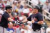 Atlanta Braves Conner Capel is greeted by Sean Murphy, left, after scoring on an RBI single by Nick Allen in the third inning of a spring training baseball game against the Minnesota Twins in Fort Myers, Fla., Saturday, Feb. 22, 2025. (AP Photo/Gerald Herbert)