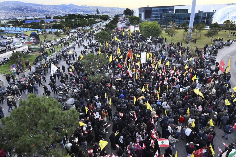 Hezbollah supporters protest near Beirut's international airport against Lebanon's decision to revoke permission for an Iranian carrier after Israel accused Iran of smuggling cash to Hezbollah, in Beirut, Lebanon, Saturday, Feb. 15, 2025. (AP Photo)