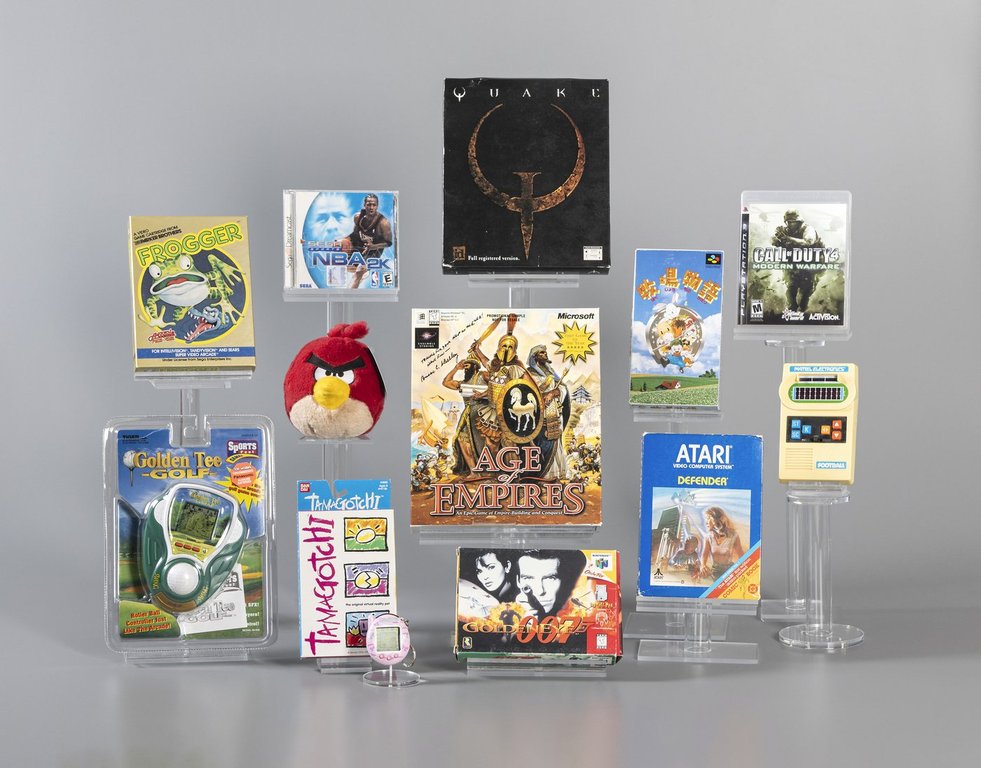 This photo from the The Strong's World Video Game Hall of Fame in Rochester, N.Y., shows the 12 finalists being considered for induction in 2025: Age of Empires, Angry Birds, Call of Duty 4: Modern Warfare, Defender, Frogger, Golden Eye, Golden Tee, Harvest Moon, Mattel Football, Quake, NBA 2K, and Tamagotchi. (The Strong's World Video Game Hall of Fame via AP)