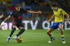Barcelona's Lamine Yamal, left, duels for the ball with Las Palmas' Stefan Bajcetic during the Spanish La Liga soccer match between Las Palmas and Barcelona at the Gran Canaria stadium in Las Palmas, Spain's Canary Islands, Saturday, Feb. 22, 2024. (AP Photo/Gabriel Jimenez)