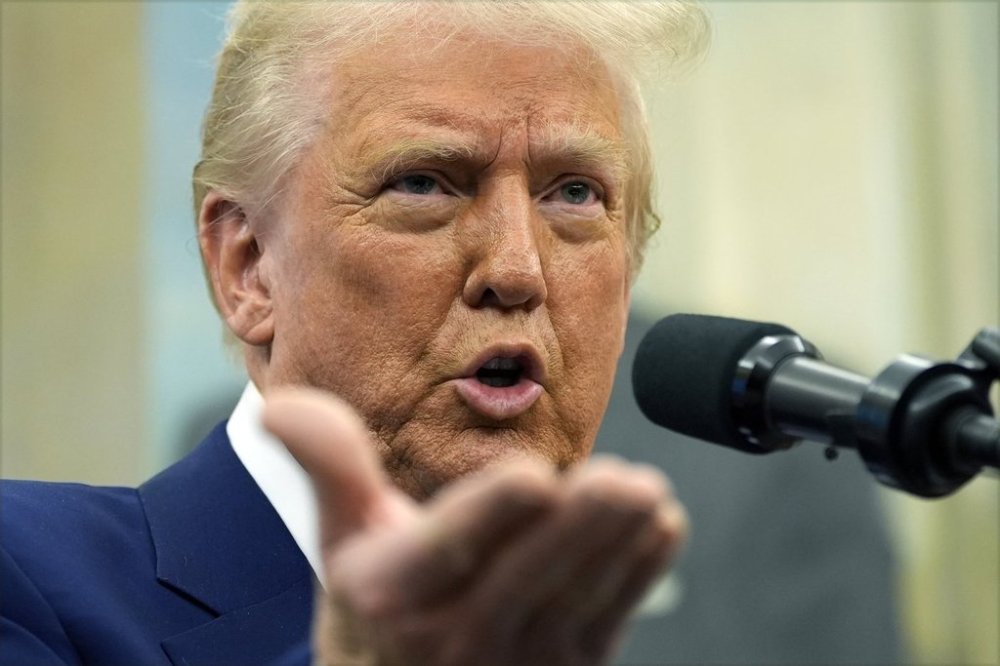 President Donald Trump speaks as Tulsi Gabbard is sworn in as the Director of National Intelligence in the Oval Office of the White House, Wednesday, Feb. 12, 2025, in Washington. (Photo/Alex Brandon)