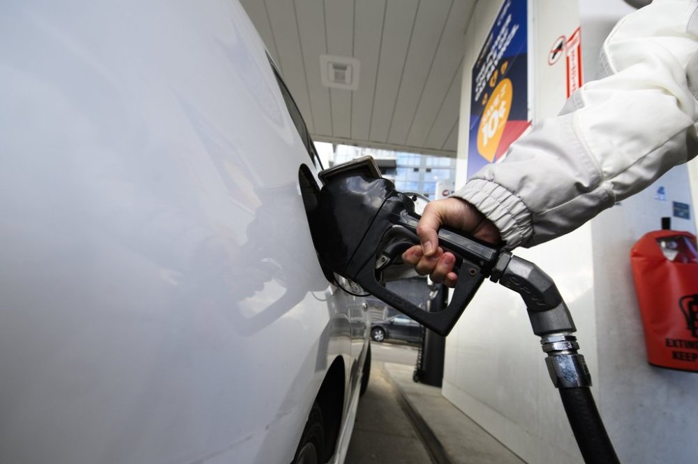 A person pumps gas into their vehicle at a gas station in Mississauga, Ont., Tuesday, Feb. 13, 2024. THE CANADIAN PRESS/Christopher Katsarov