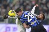 Inter Milan's Benjamin Pavard, left, and Juventus' Weston McKennie, right, challenge for the ball during the Italian Serie A soccer match between Juventus and Inter Milan at the Juventus Stadium in Turin, Italy, Sunday, Feb. 16, 2025. (Spada/LaPresse via AP)