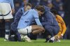 Manchester City's Jack Grealish gets treatment before leaving the field injured during the Champions League playoff first leg soccer match between Manchester City and Real Madrid at the Etihad Stadium in Manchester, England, Tuesday, Feb. 11, 2025. (AP Photo/Darren Staples)