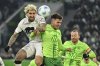 Leverkusen's Robert Andrich, left, plays against Wolfsburg's Kilian Fischer during the German Bundesliga soccer match between VfL Wolfsburg and Bayer Leverkusen at the Volkswagen Arena in Wolfsburg, Germany, Saturday, Feb. 8, 2025. (Swen Pfortner/dpa via AP)