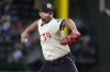 FILE - Texas Rangers closing pitcher Kirby Yates throws during the ninth inning of a baseball game agains the Tampa Bay Rays in Arlington, Texas, on July 5, 2024. (AP Photo/LM Otero, File)