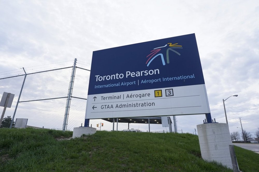 A sign for Toronto Pearson International Airport is pictured in Mississauga, Ont., on Thursday, April 20, 2023. THE CANADIAN PRESS/Arlyn McAdorey