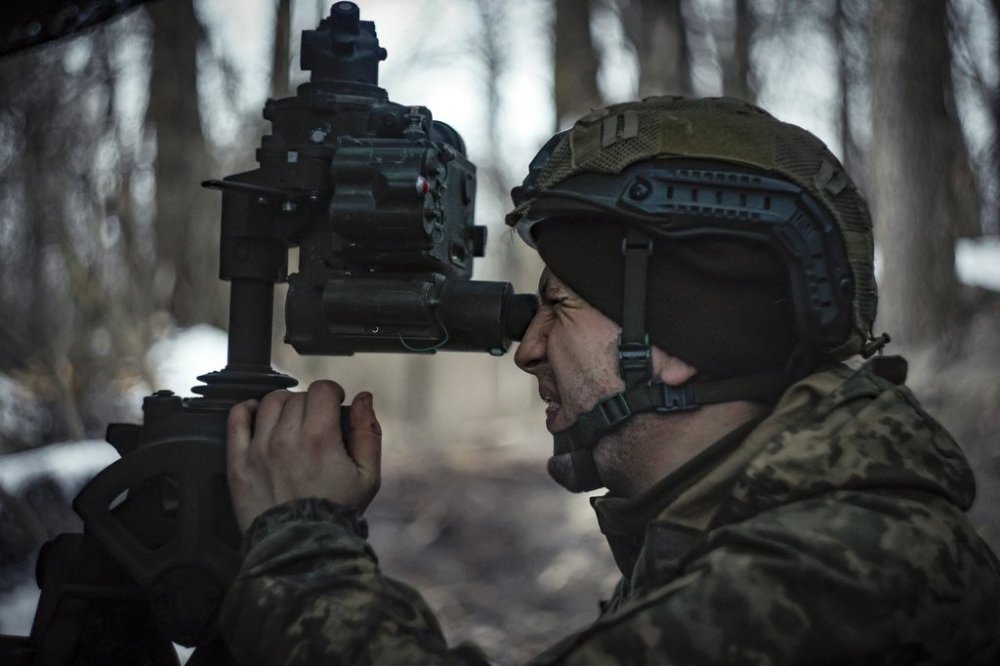 A Ukrainian serviceman prepares to fire a M777 howitzer towards Russian positions at the frontline near Donetsk, Ukraine, Monday, March 3, 2025. (AP Photo/Roman Chop)