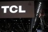 FILE -TCL logo is seen as workers prepare a booth during setup for the CES tech show Jan. 4, 2022, in Las Vegas. (AP Photo/Joe Buglewicz,File)