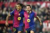 Barcelona's Eric Garcia celebrates with Jules Kounde, left, after scoring his side's fourth goal during a Spanish La Liga soccer match between Sevilla and FC Barcelona at the Ramon Sanchez Pizjuan stadium in Seville, Spain, Sunday, Feb. 9, 2025. (AP Photo/Jose Breton)