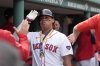 FILE - Boston Red Sox's Rafael Devers celebrates with teammates in the dugout after scoring on his three-run home run the fourth inning of a baseball game against the Arizona Diamondbacks, Aug. 25, 2024, in Boston. (AP Photo/Steven Senne, file)