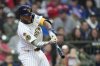 Milwaukee Brewers' Jackson Chourio hits a three-run home run during the fourth inning of a baseball game against the Cincinnati Reds, Sunday, April 6, 2025, in Milwaukee. (AP Photo/Aaron Gash)