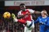 FILE - Arsenal's Bukayo Saka, left, kicks the ball ahead of Everton's Vitaliy Mykolenko during the English Premier League soccer match between Arsenal and Everton at Emirates Stadium in London, Dec. 14, 2024. (AP Photo/Kin Cheung, File)