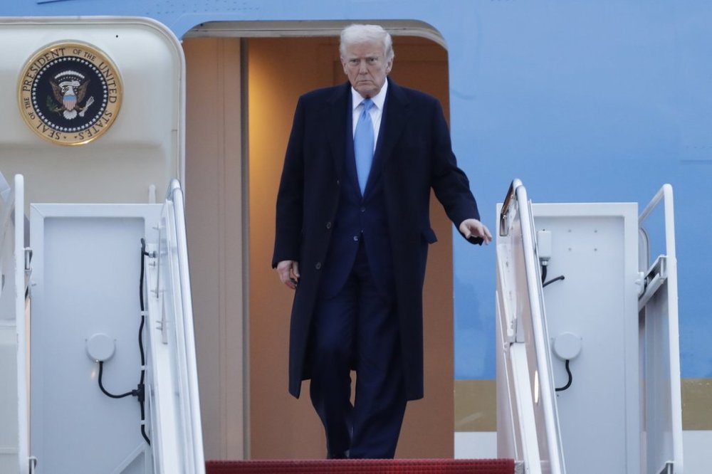 President Donald Trump walks down the stairs of Air Force One upon his arrival at Joint Base Andrews, Md., Sunday, April 6, 2025. (AP Photo/Luis M. Alvarez)