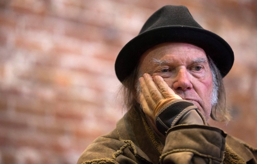 Canadian musician Neil Young listens to a question during a news conference in Vancouver, B.C., on Monday, November 23, 2015 for the Canadian launch of his PonoPlayer portable music player and the PonoMusic music download service. THE CANADIAN PRESS/Darryl Dyck