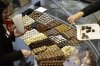 FILE - Visitors taste different sorts of chocolate, during the second International Salon des Chocolatiers et du Chocolat, on Oct. 27, 2012 in Geneva, Switzerland. (Martial Trezzini/Keystone via AP)