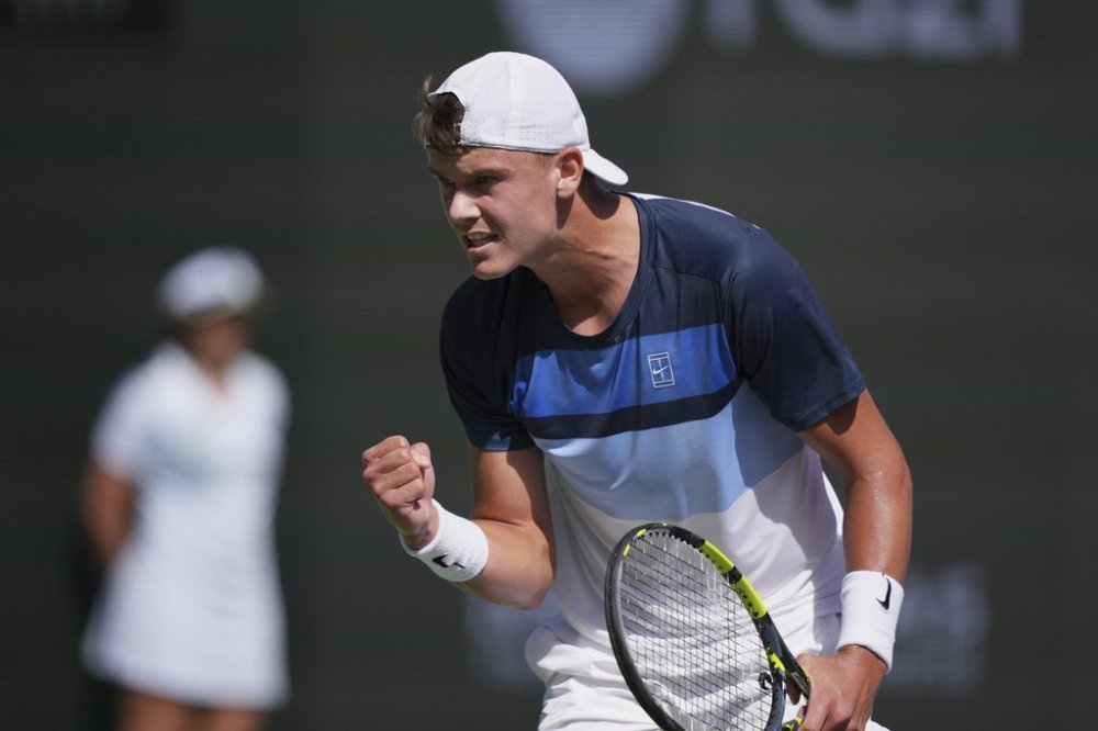 Holger Rune, of Denmark, celebrates a point against Daniil Medvedev, of Russia, during their semifinals match at the BNP Paribas Open tennis tournament Saturday, March 15, 2025, in Indian Wells, Calif. (AP Photo/Mark J. Terrill)