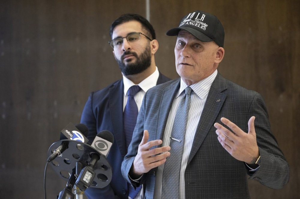 Ferguson's attorney Jeffrey Talley, right, talks to the media as co-counsel Kevin Newman listens in Santa Ana, Calif., Monday, March 10, 2025. (Mindy Schauer/The Orange County Register via AP)