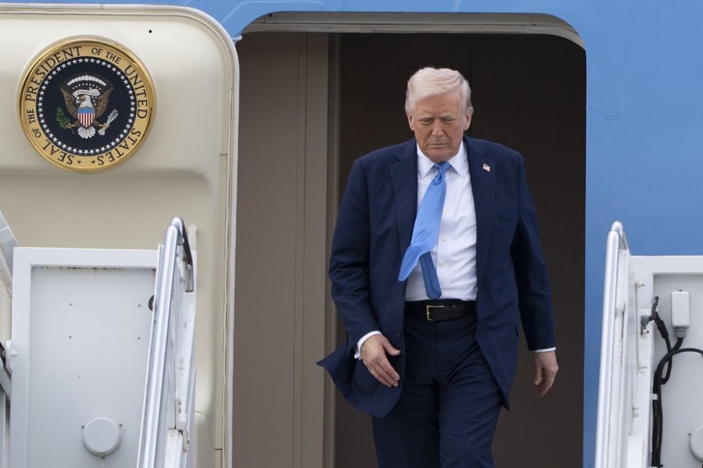 President Donald Trump arrives on Air Force One at Palm Beach International Airport, Friday, March 28, 2025, in West Palm Beach, Fla. (AP Photo/Manuel Balce Ceneta)